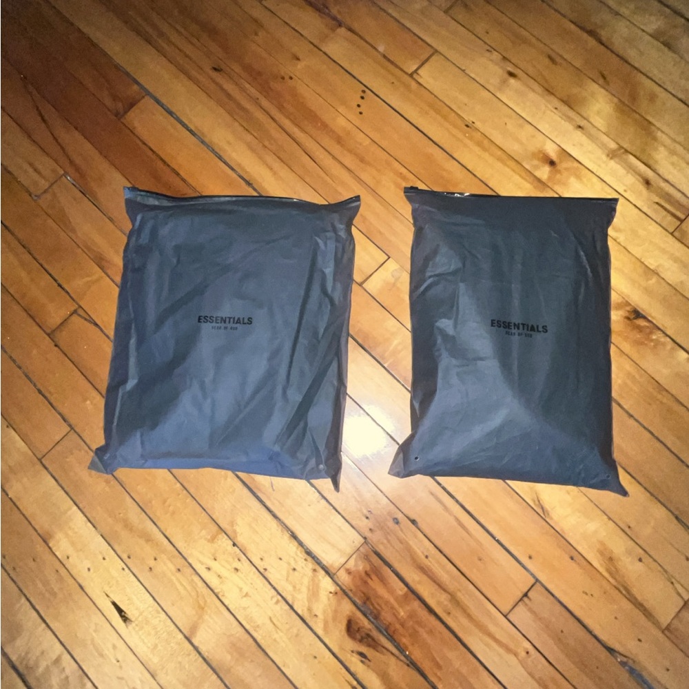 Fear of God Essentials Sweater in Black Packaging